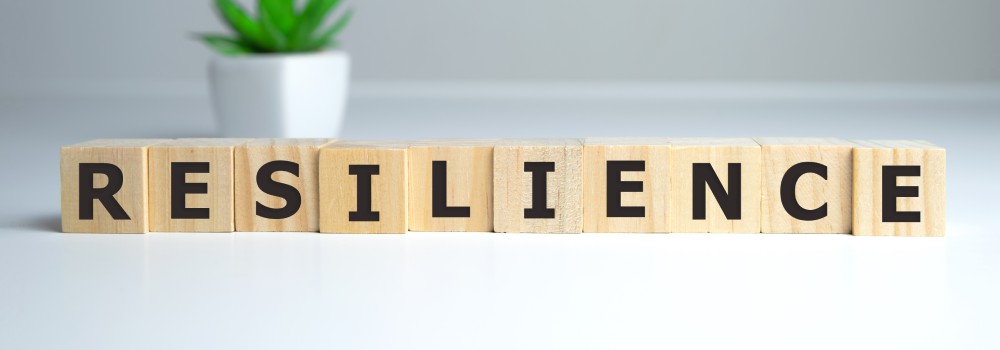 resilience spelled out by scrabble tiles